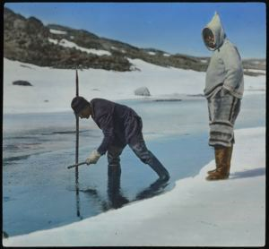 Image of Ralph Robinson Spearing Trout, [with Kavavou] Baffin Land